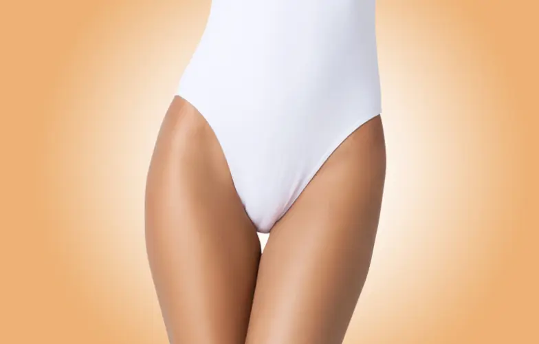 Perfect slim toned young body of brunette sensual girl, fit woman at studio. The fitness, diet, sports, plastic surgery and aesthetic cosmetology concept. Long legs.